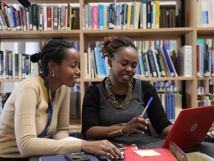 Two students studying in library